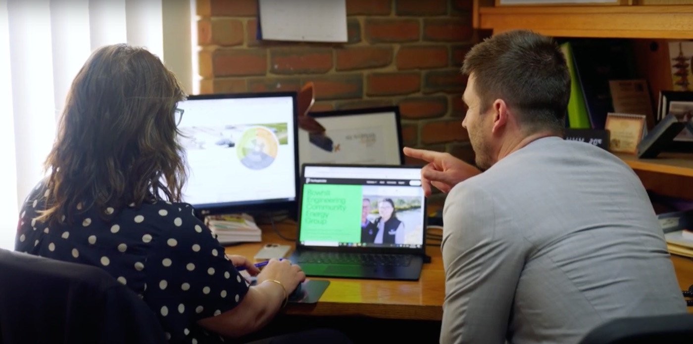 An EnergiForge energy expert reviewing options with a client